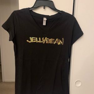 NWOT Jellybean Famous DJ Benitez t shirt. Gold sequined lettering. V neck.